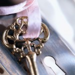 Ornate golden key on a ribbon